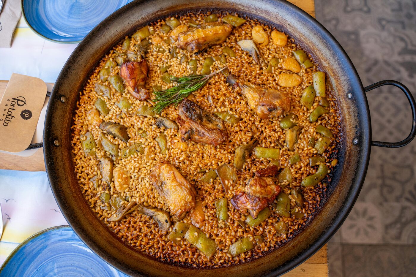 Traditional Valencian paella with chicken, rabbit and green beans
